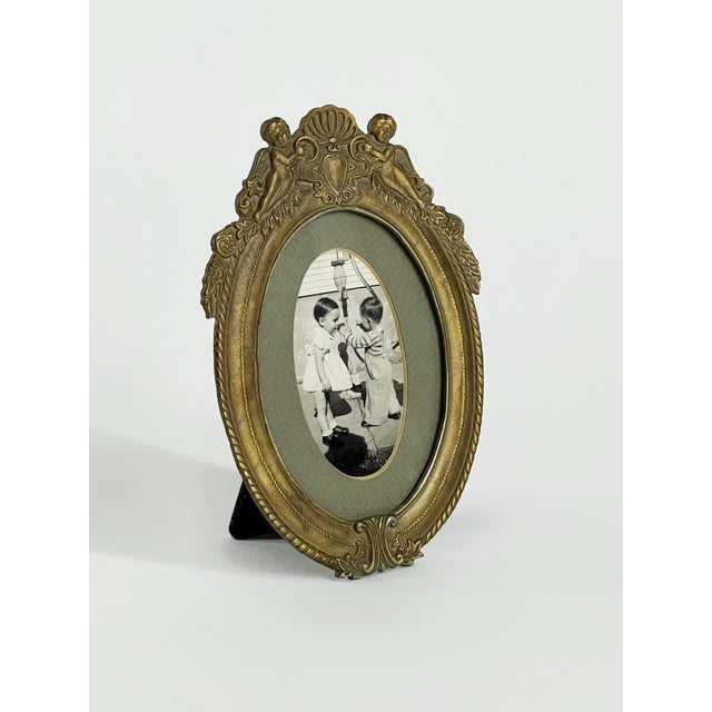 Vintage French cast brass dresser frame. Easel back, great patina, great for a bookcase or shelf too. 4.5" x 6.5" overall