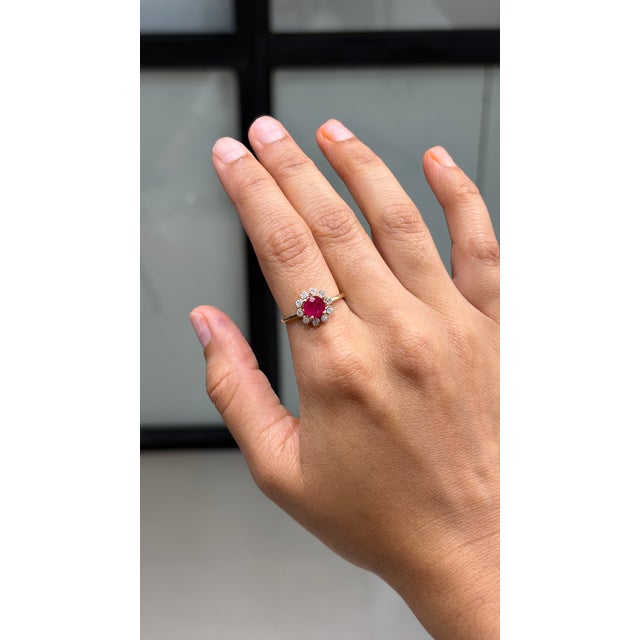 This victorian-style cluster flower ring features a striking 1.04ct ruby & diamond, set in 14K yellow gold. The ruby...