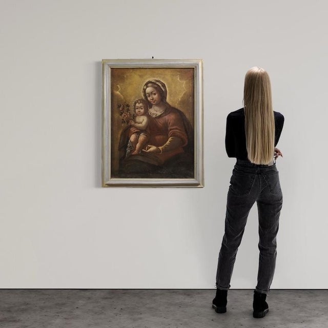 Antique Italian painting from the late 17th century. Oil on canvas artwork depicting a religious subject, Madonna and...