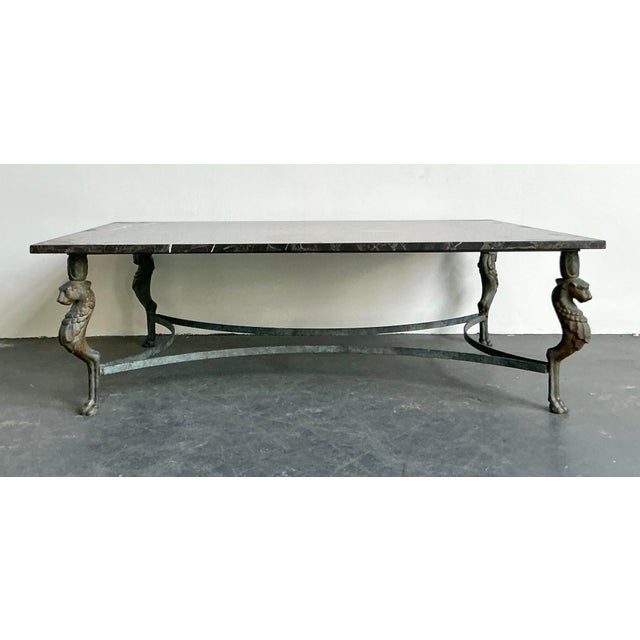 Command attention in your living space with this spectacular vintage Neoclassical coffee table, a piece that perfectly...