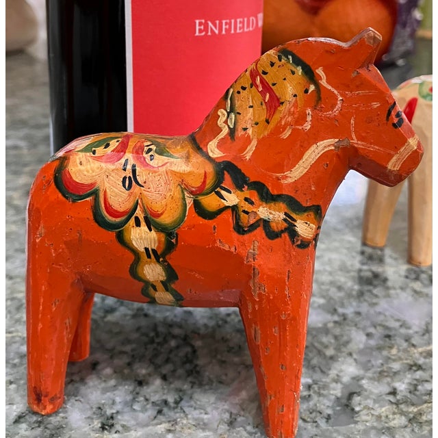 MCM small orange Swedish Dala Horse from Sweden. Hand painted in yellow, red and dark green. Good vintage condition with...