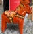 MCM small orange Swedish Dala Horse from Sweden. Hand painted in yellow, red and dark green. Good vintage condition with...
