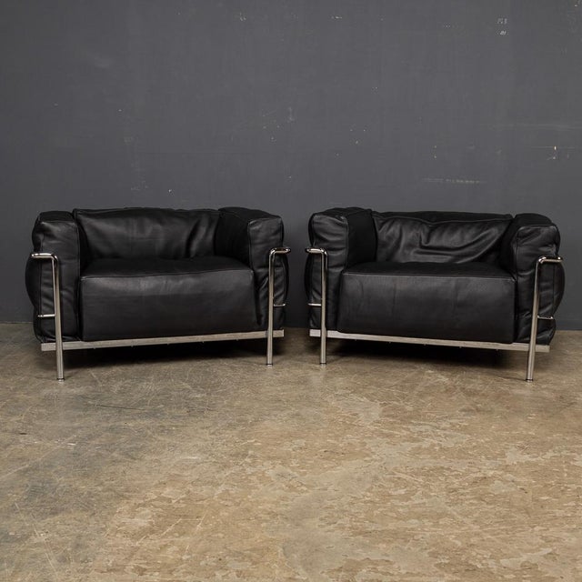A pair of 3 Fauteuil Grand Confort Grand Modèle Durable Cassina Armchairs. By Le Corbusier, designed by Pierre Jeanneret,...
