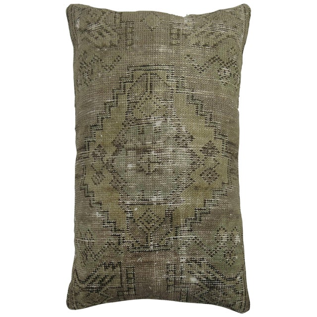 Pillow made from a distressed vintage Turkish rug. zipper closure and poly insert provided. Measures: 16'' x 24''.