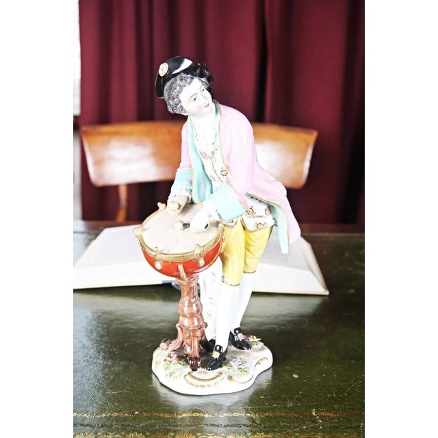 Hand-modeled and painted porcelain figurines of a dancer and a musician. The figurines are marked on the back. Very good...