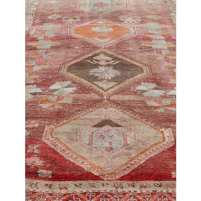 Turkish tribal design colorful gallery runner in soft red and multi colors. Keivan Woven Arts / rug EN-179883, country of...