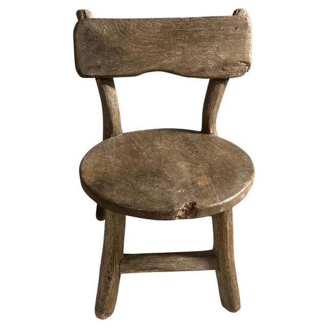 Antique village chair that can also be used as a side table. We have a small collection. Lovely patina and character on...
