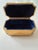 Elegant American Art Deco jewelry casket by Jennings Brothers, featuring a sculptural sunburst/fan motif and rich gilt...
