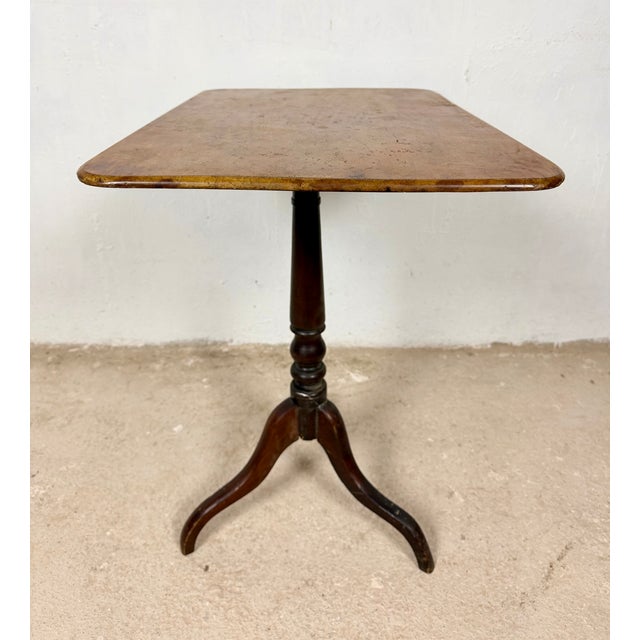 Spanish rectangular-top side table dating from the mid-20th century. Crafted in wood, it features a rectangular top...