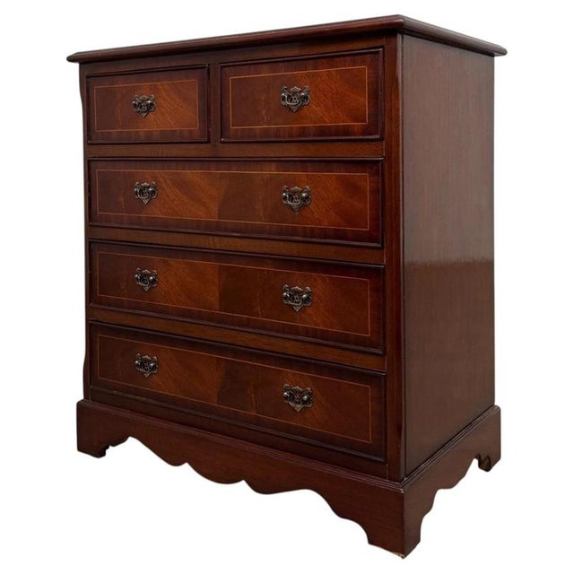 A beautifully proportioned early 20th-century English chest of drawers, finely constructed in mahogany and distinguished...