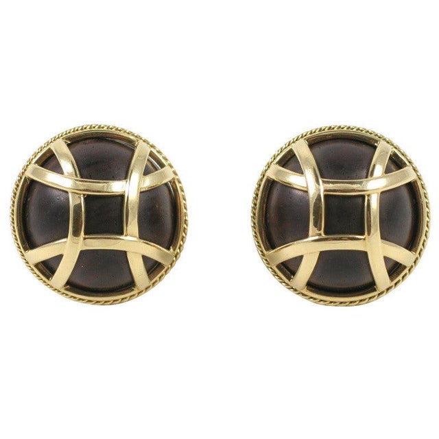 Elegant 18kt Yellow Gold and Wood 3 Octaves domed Earring. The wood is a deep brown color. The diameter is approximately~...