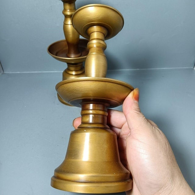 Elevate your dining table or mantel with this impressive pair of vintage-style brass candlesticks. Crafted from solid...