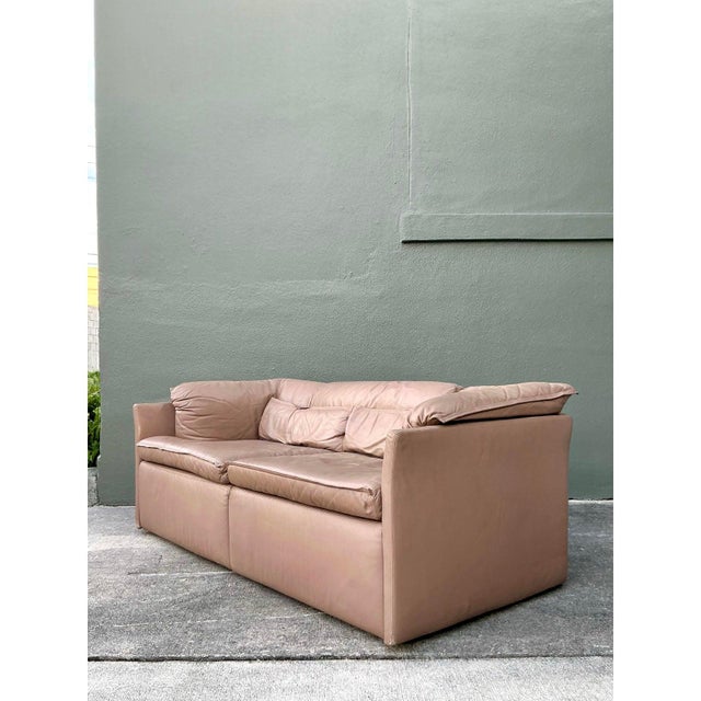 This sophisticated sofa embodies the low-slung luxury and clean lines of high-end Mid-Century Modern Italian design,...