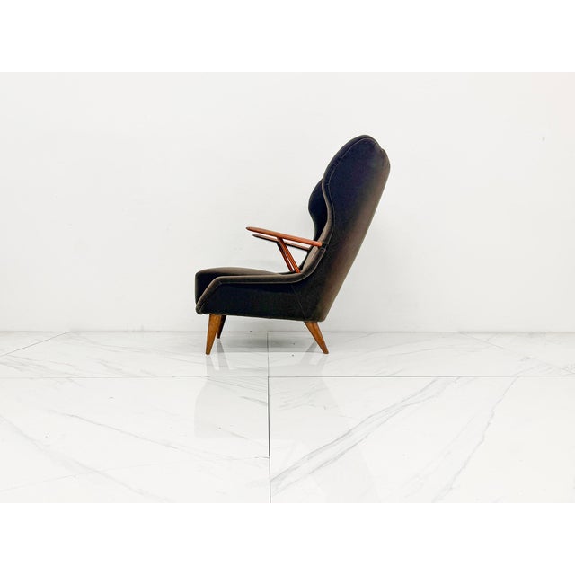 An exceptionally sculptural Mid-Century Modern high-back wing chair designed by Georg Thams for Vejen Polstermøbelfabrik,...