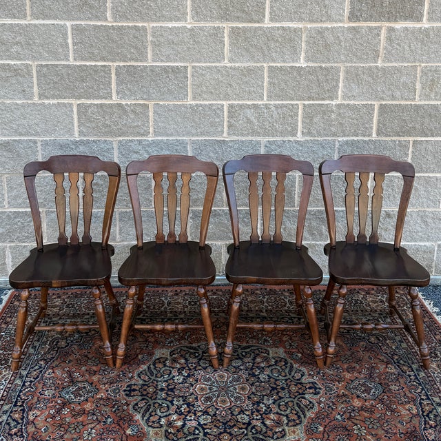 A set of 4 late 20th century Ethan Allen Antiqued Pine collection Rustic Traditional dining chairs known as the Country...
