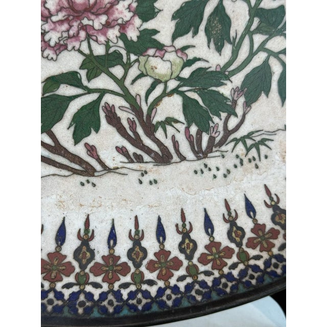 An important early Meiji Japanese cloisonne enamel charger on the rare white ground, 17.5 inches in diameter. The central...