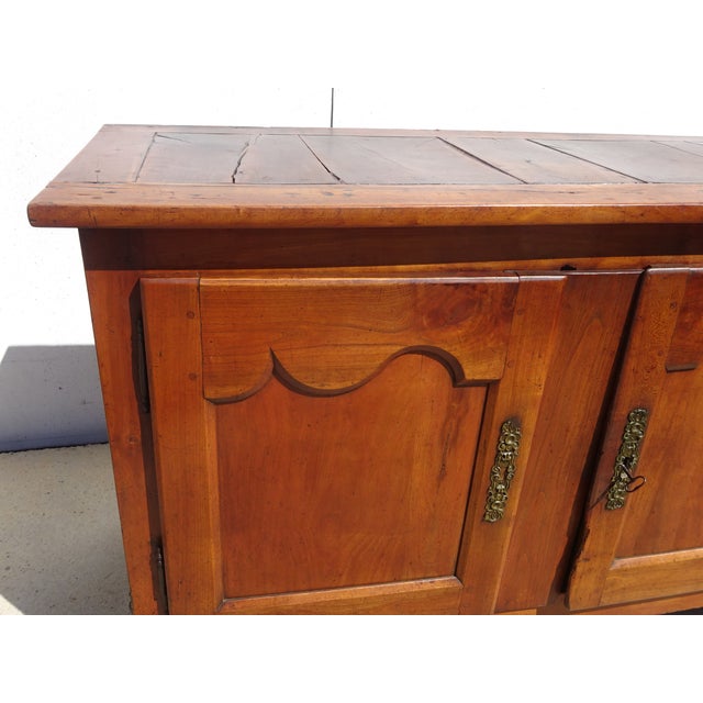 19th-century piece of furniture, a very old solid oak sideboard, entirely pegged. The top is made of interlocking oak...