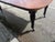 This 2 leaf 19th century English Victorian mahogany extension dining table is a stunning antique piece that exudes vintage...