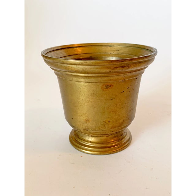A beautiful solid bronze antique gilt apothecary mortar in an urn shape. This is a very heavy piece, and possibly from a...