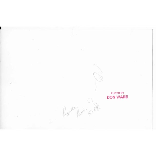 1984 black and white photo by Don Ware (1921-2006) of the Moulin Rouge and its windmill in the Pigalle in Paris, France....