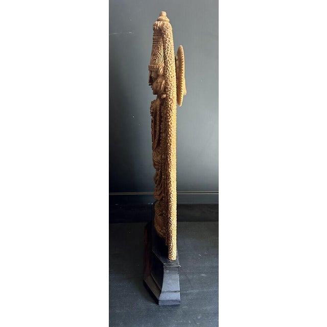 A hand carved statue by master craftsman from one solid piece of wood, depicting one of the most revered of all Hindu...