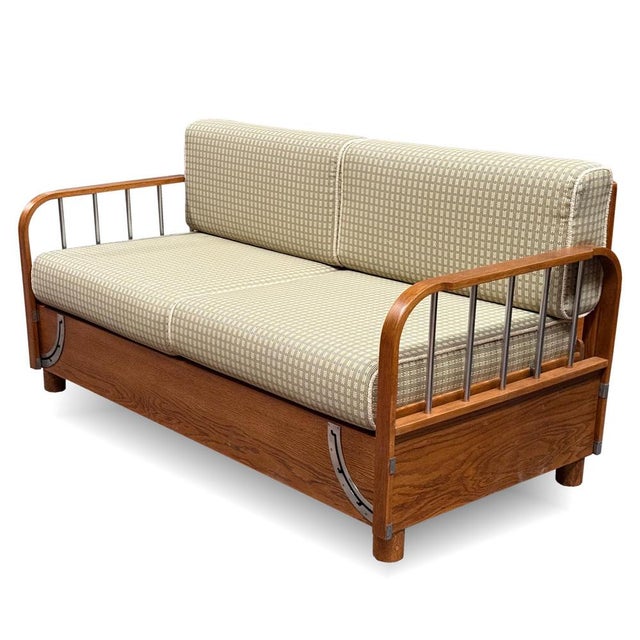 A functionalist pull-out sofa designed by jindřich halabala for up závody in brno, model h–215, from the 1930s. The...