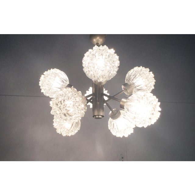 Imposing chandelier from Germany by Richard Essig, Besigheim. A sphere has a defect in the glass, but it is inside the...