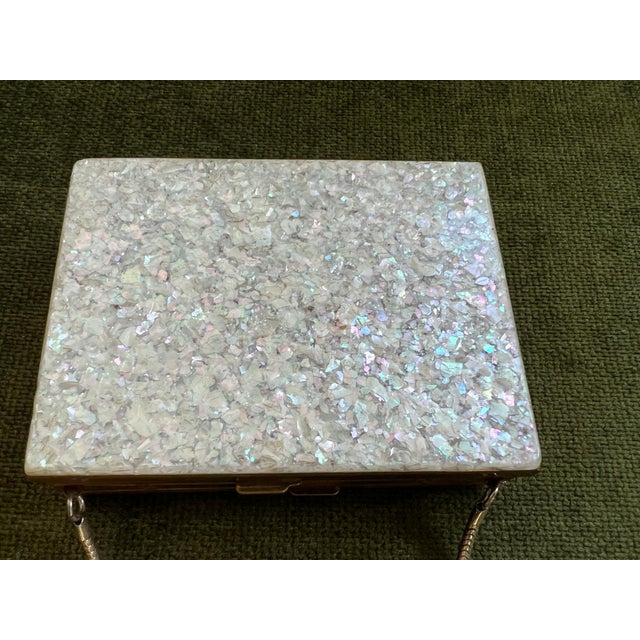 1950s mid-century EVANS wristlet compact and cigarette case with Mother of Pearl cover. This elegant vintage wristlet is...