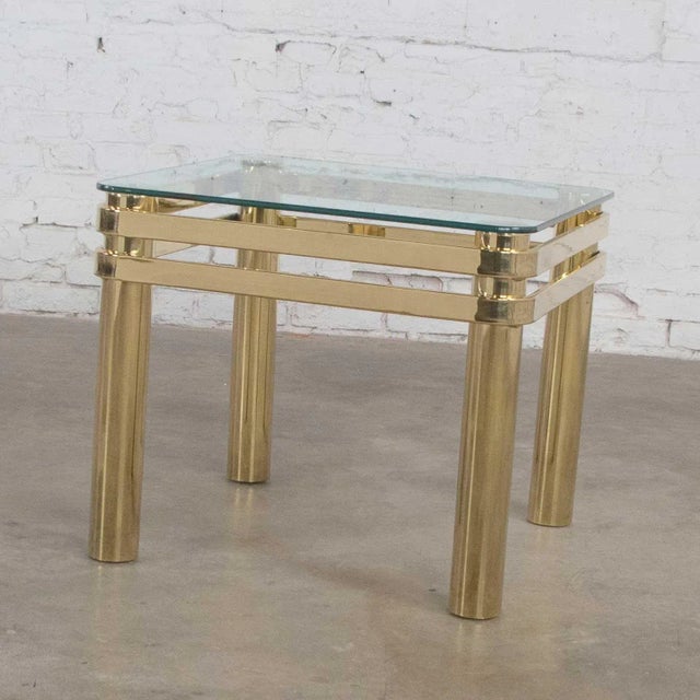 Handsome modern design somewhat Hollywood Regency style brass and glass side table or end table similar to pieces by Pace...