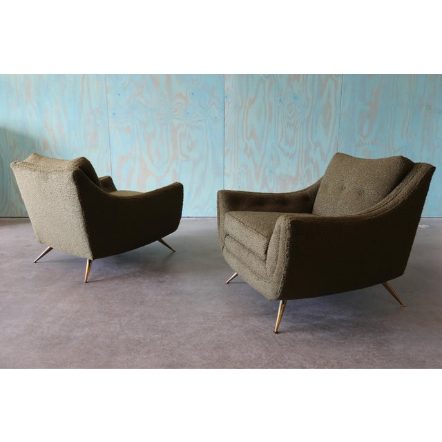 A pair of deep modern lounge chairs Attributed to Henry P Glass for J.L. Chase Co. for the forecast group. This example...