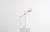 Available now and for immediate delivery. This slim lamp has a familiar presence that reminds us of the Art Deco style...