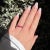 Vintage Eternity Wedding Ring, from the 1990s. In 18 carat white gold (750 thousandths), it is set with 22 natural rubies,...