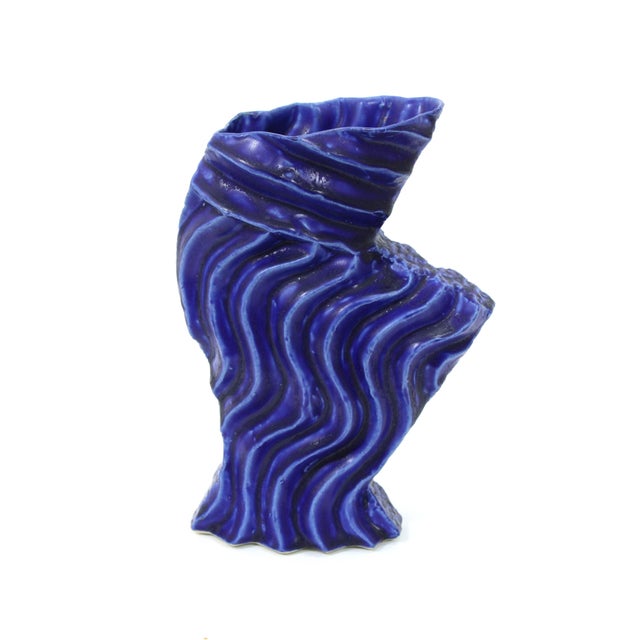 Bold vintage studio pottery vase, with a unique organic composition and parallel deep ridges throughout. Has a rich array...