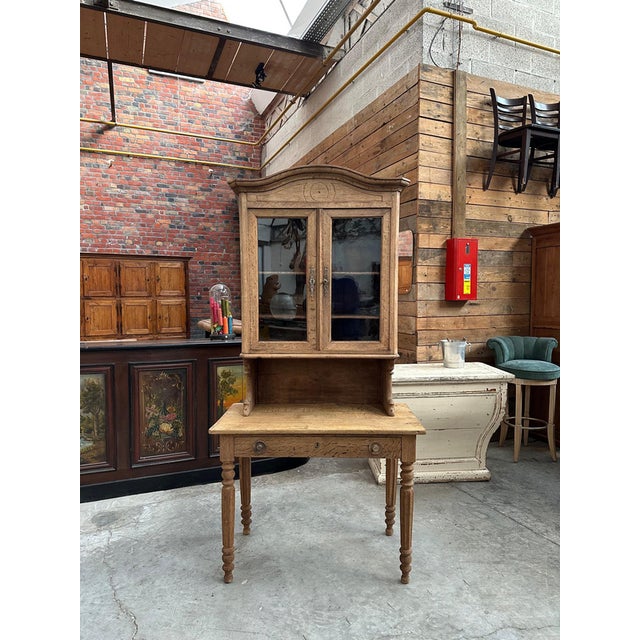 This former oak notary desk has been completely restored. The upper section has two lockable glass doors that open onto...