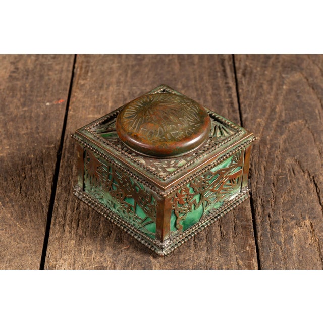 c. 1900s-1910s; Tiffany Studios - New York City, NY Square desk inkwell executed in patinated bronze with pierced foliate...