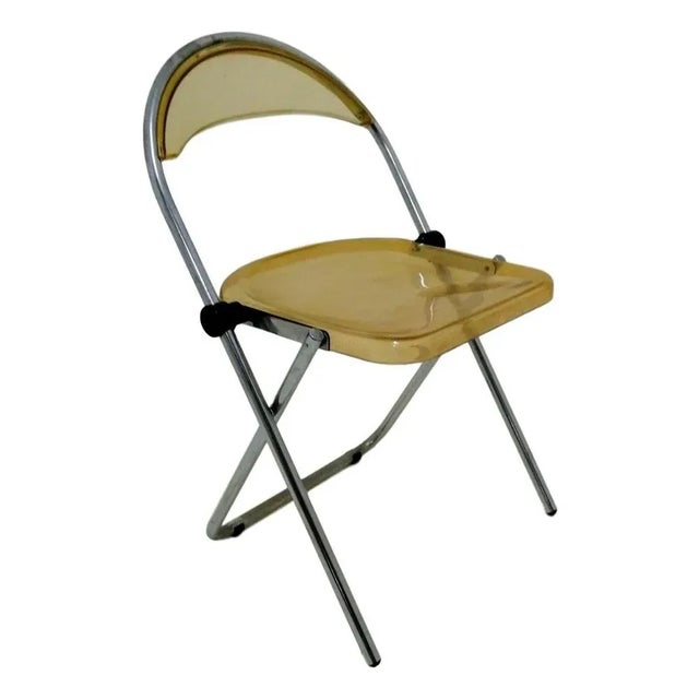 This is a set of 4 acrylic glass and steel chairs, original 70's, probably produced on the wave of the success of...