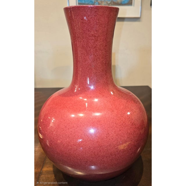 "Long thin narrow neck with a wide bottom has measurements of approximately 10"x10"x14"