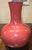 "Long thin narrow neck with a wide bottom has measurements of approximately 10"x10"x14"