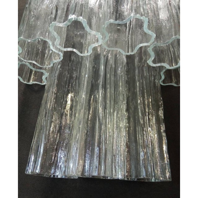 Murano glass appliques blown in a detention, transparent color cortex finish form Similar Stella. Nikel metal structure,...