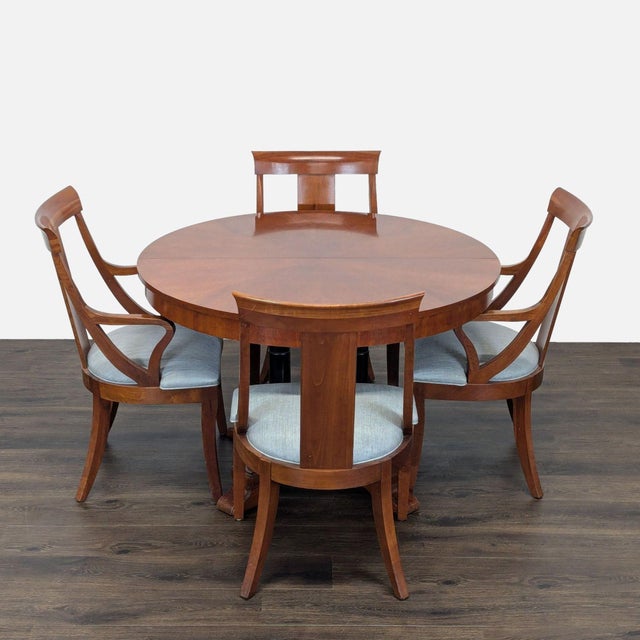 This elegant Ethan Allen dining set features a sturdy wooden table with an extendable design, perfect for family meals or...