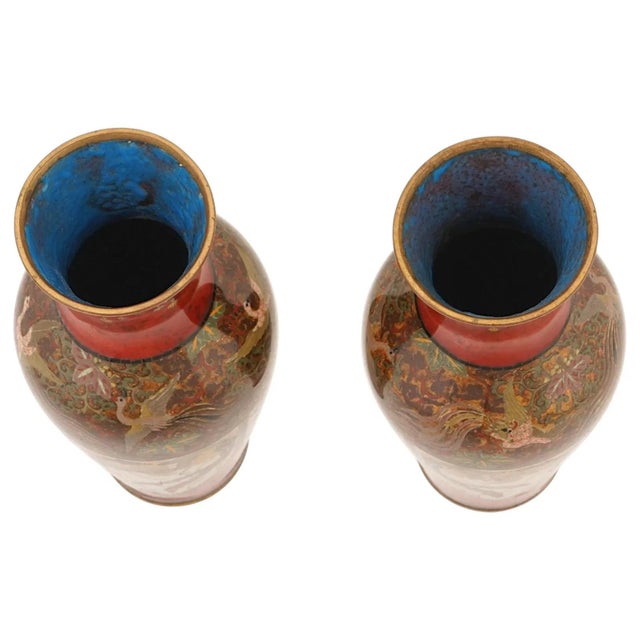 A rare and visually arresting pair of Japanese cloisonné enamel vases, circa 1890, likely produced by the Honda School...
