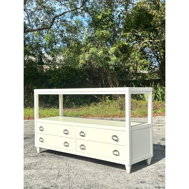 This exquisite Alexa Hampton for Hickory Chair credenza embodies timeless Regency elegance with its sleek lacquered finish...