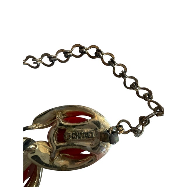 Fabulous gold tone necklace with red marbled bakelite. Charel stamped.