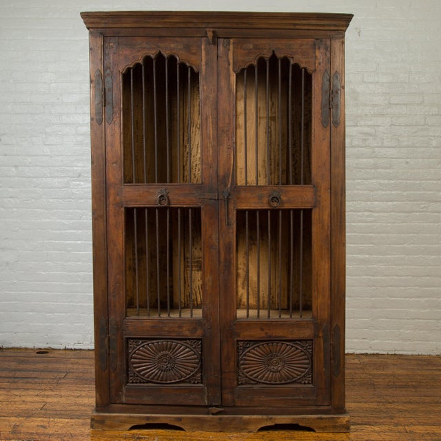 Indian Antique Cabinet With Pierced Doors Carved Motifs And Bronze Spindles Chairish