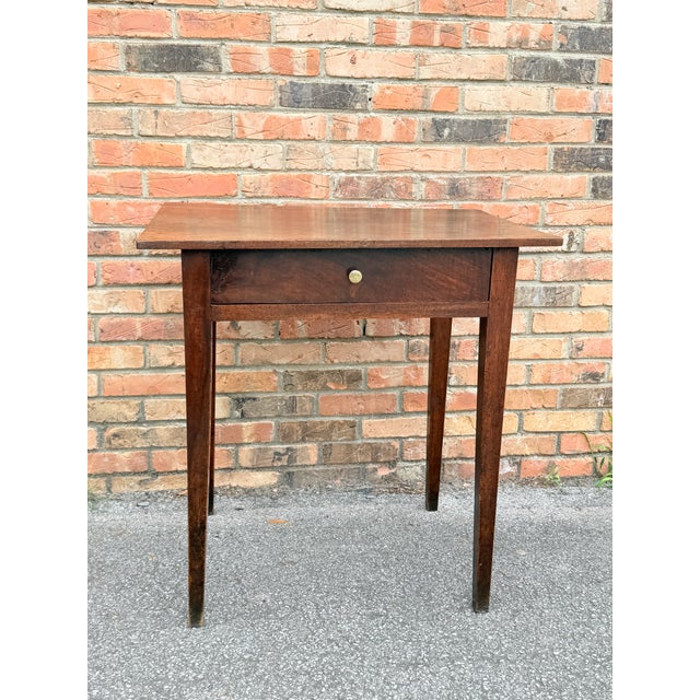 This sweet side table features a storage drawer with a lovely brass knob. The finish has a rich character, lovely patina...