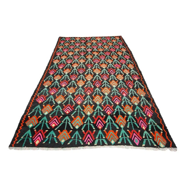 Vintage handwoven kilim rug from Kars region of Turkey. Approximately 55-65 years old. In very good condition.