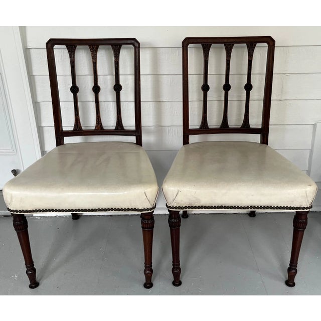 Pair antique 18th century George III neoclassical carved mahogany side chairs with carved details and white leather...