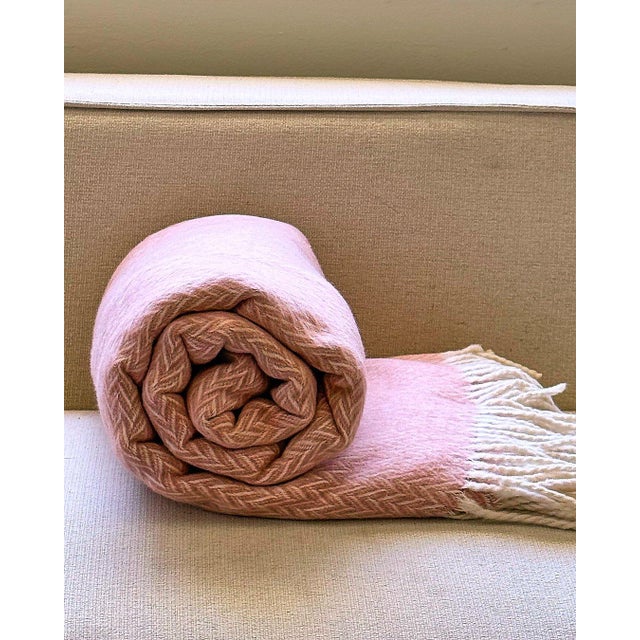The “Marina Throw Jacquard” from Arlene Angard Designs and Fine Arts, a soft, high-quality throw made from recycled...