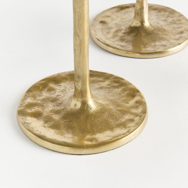 With a dramatic taper at the bottom and rich texture, these grand taper holders are slender & tall modern works of art....
