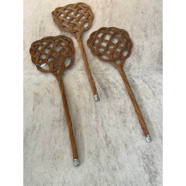 A great set of vintage woven rattan rug beaters. Makes a great wall display, yet still functional!